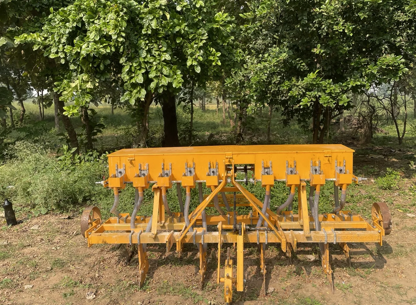 The yellow drill, with its hopper, delivery tubes and row of openers.
