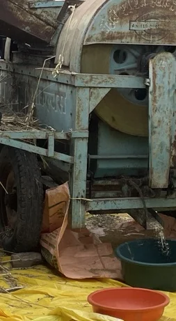 A chute and collection area beside the machine.